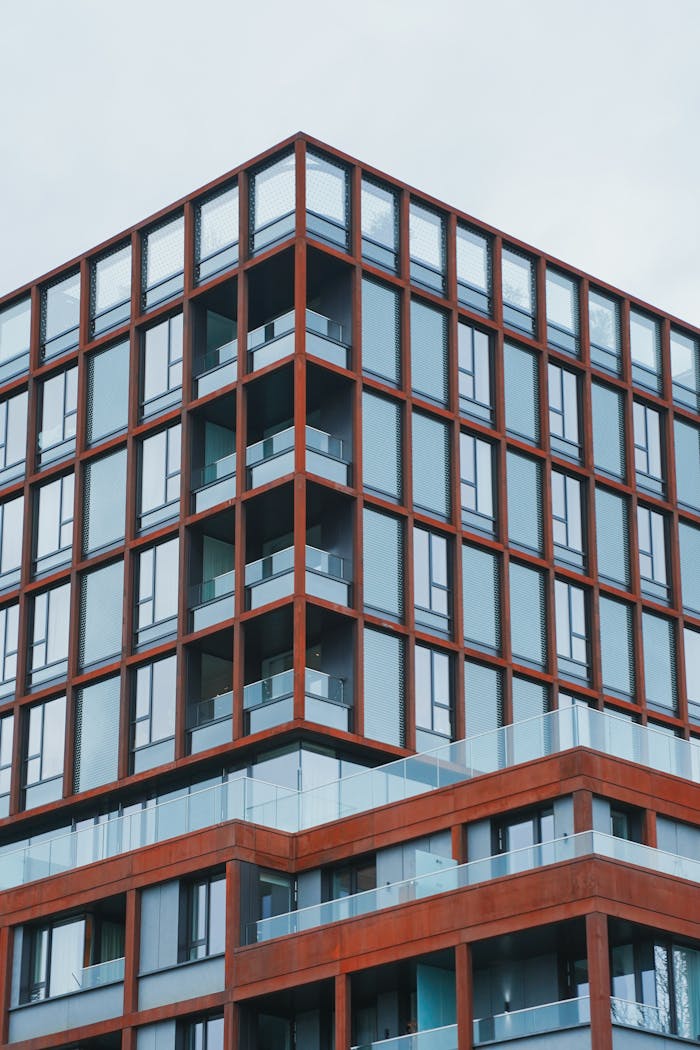 Contemporary architecture of a modern residential building with glass and metal facade.